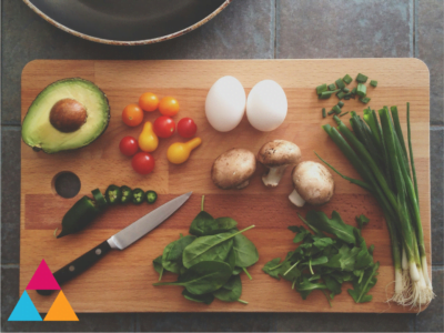 A chopping board with a variety of fresh healthy ingredients with different flavours