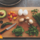 A chopping board with a variety of fresh healthy ingredients with different flavours